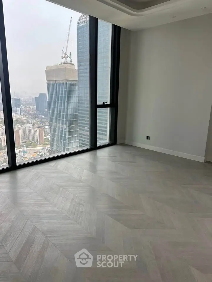 Luxurious high-rise apartment with stunning city view and elegant flooring