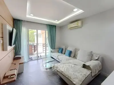 Modern living room with cozy sectional sofa and balcony view