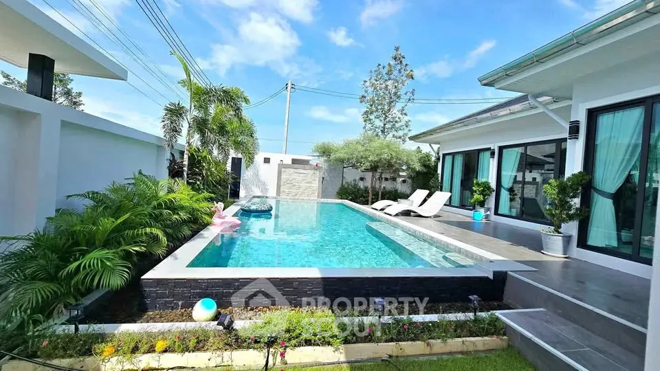Luxurious villa with private pool and lush garden, perfect for relaxation and entertaining.