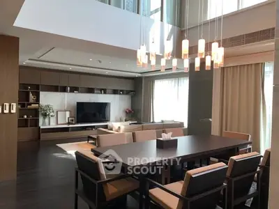 Luxurious modern living room with elegant dining area and stylish lighting