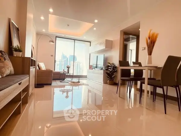 Modern living room with city view, sleek furniture, and elegant decor in a high-rise apartment.