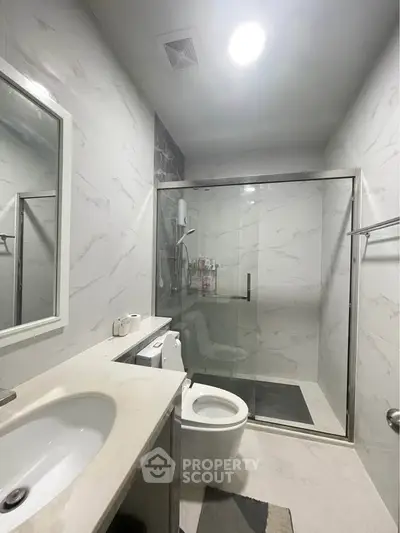 Modern bathroom with sleek design and glass shower enclosure