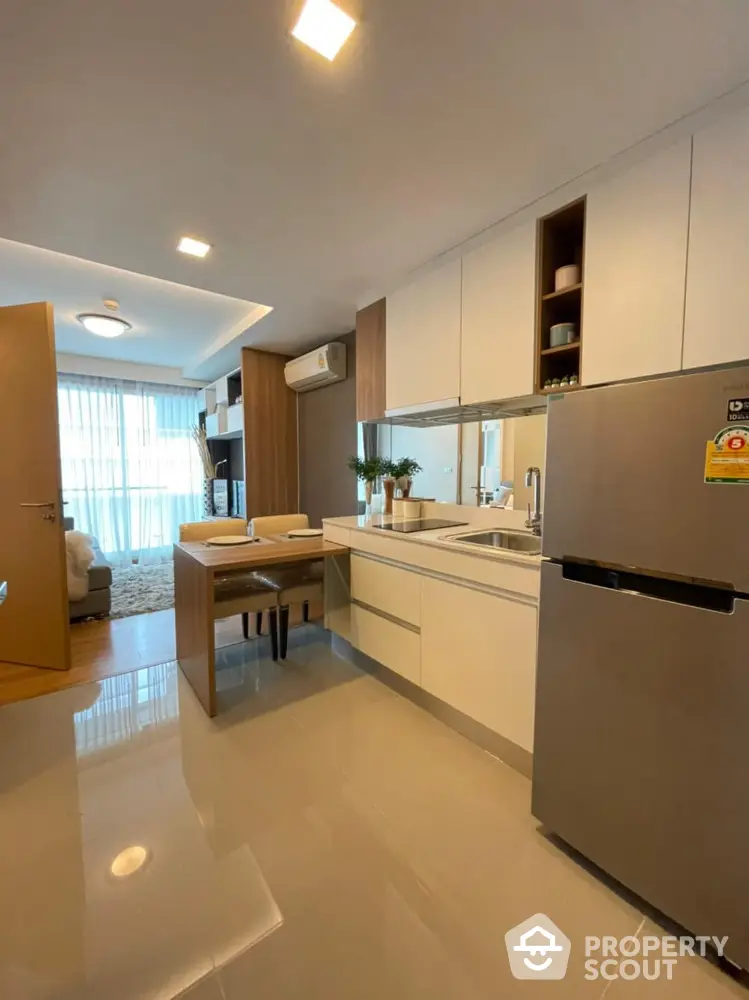 Modern kitchen with sleek design and open layout in a stylish apartment