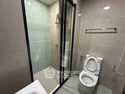 Modern bathroom with sleek shower and toilet design