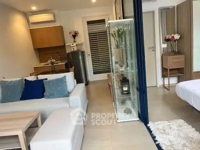 Modern open-plan living room with cozy seating and stylish decor