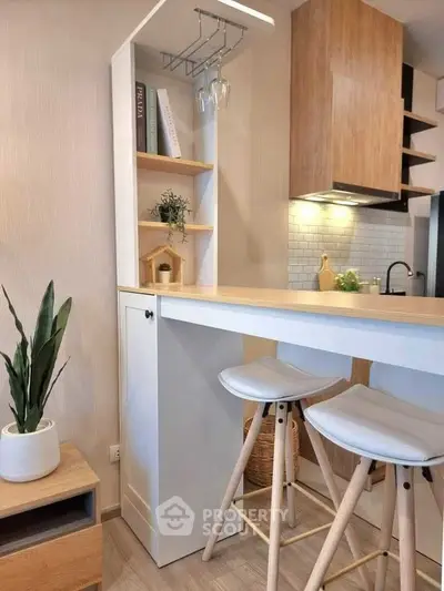 Modern kitchen with stylish breakfast bar and wooden accents
