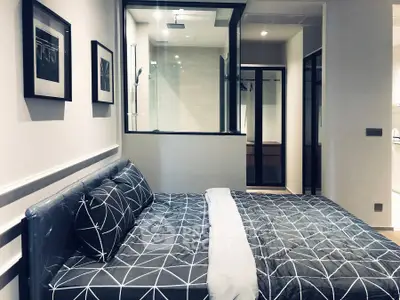 Modern bedroom with stylish decor and glass partition for a sleek, contemporary look.