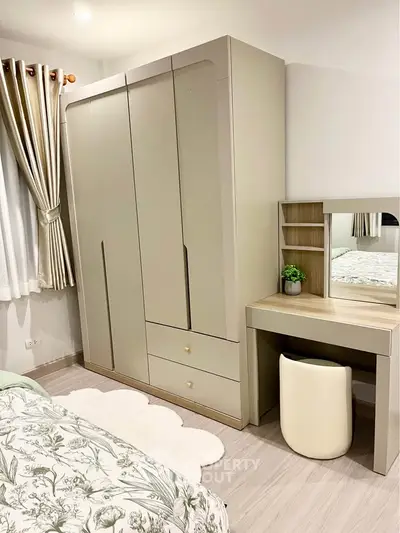 Elegant bedroom with modern wardrobe and stylish vanity set