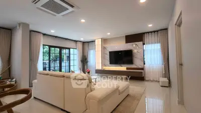 Spacious modern living room with elegant decor and large windows