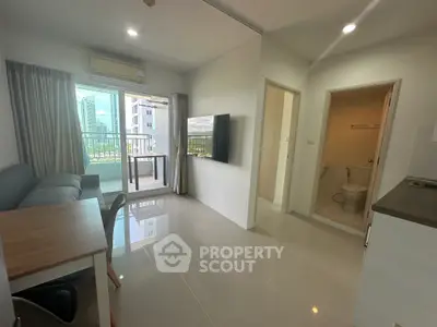 Modern apartment interior with open living area and balcony view