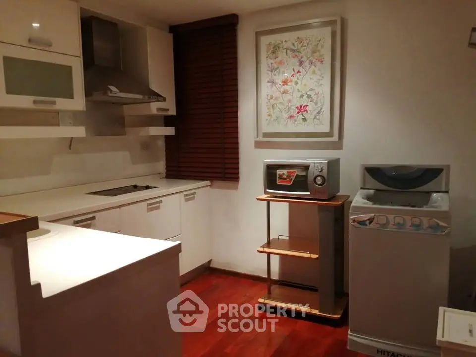 Cozy kitchen with modern appliances and stylish wooden flooring
