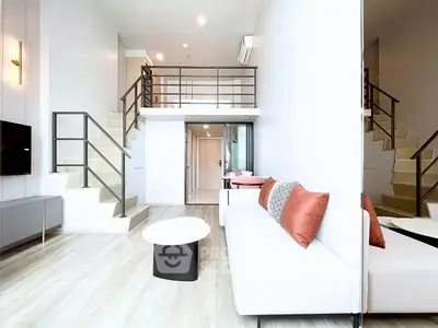 Modern duplex living room with stylish decor and mezzanine level, perfect for urban living.