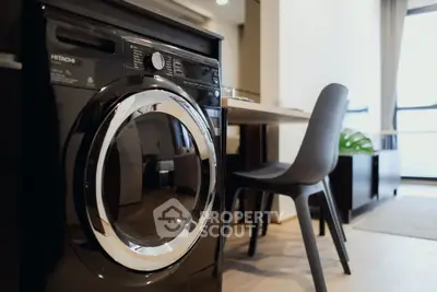 Modern apartment interior with washing machine and dining area