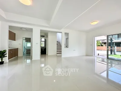 Spacious modern living room with glossy tile flooring and open layout