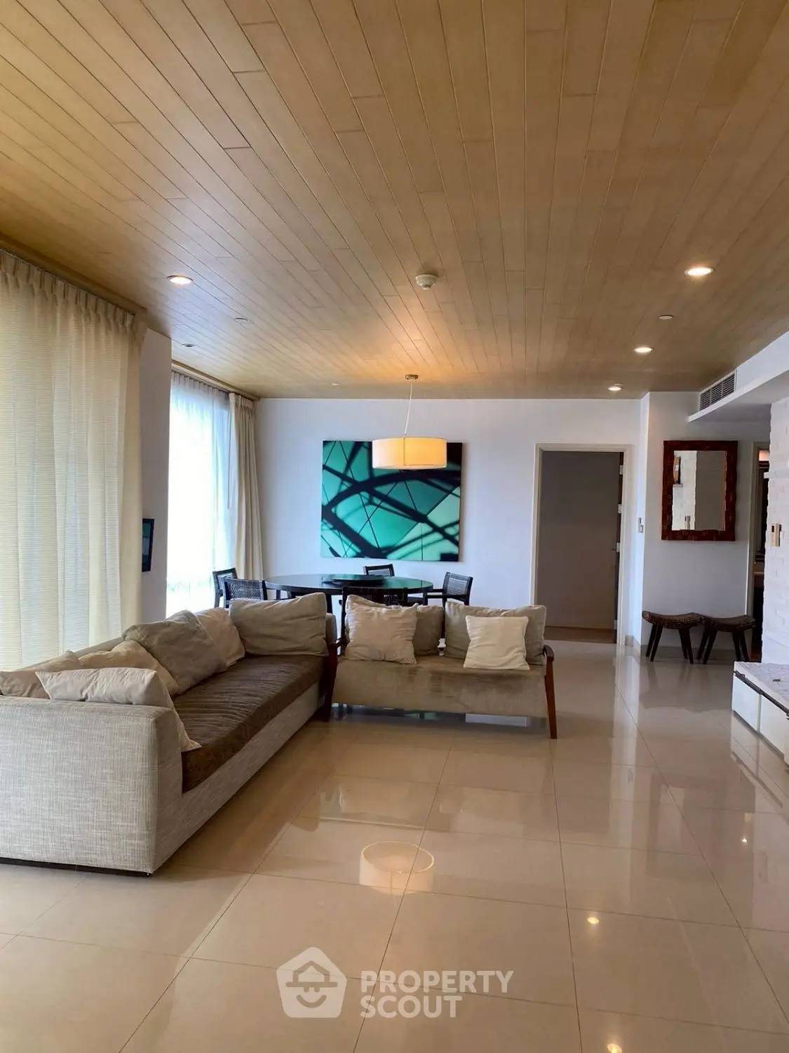 Spacious modern living room with elegant decor and natural light