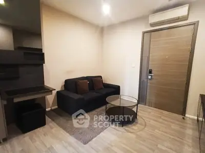 Modern living room with sleek furniture and air conditioning in a cozy apartment.