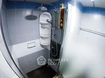 Modern bathroom with sleek shower and frosted glass door