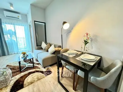 Modern living room with cozy dining area and stylish decor