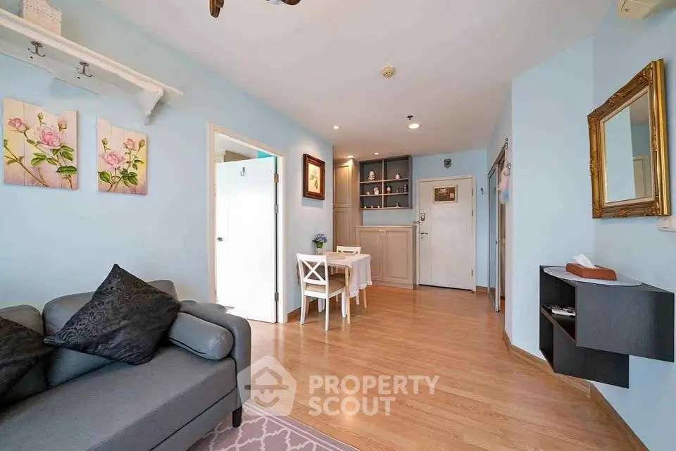 Charming living room with elegant decor and cozy seating in a modern apartment.