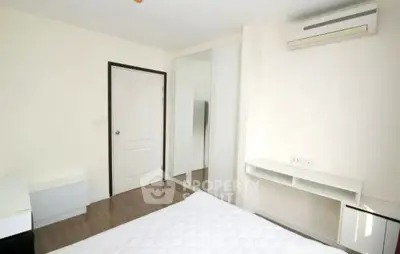 Modern minimalist bedroom with air conditioning and mirrored closet