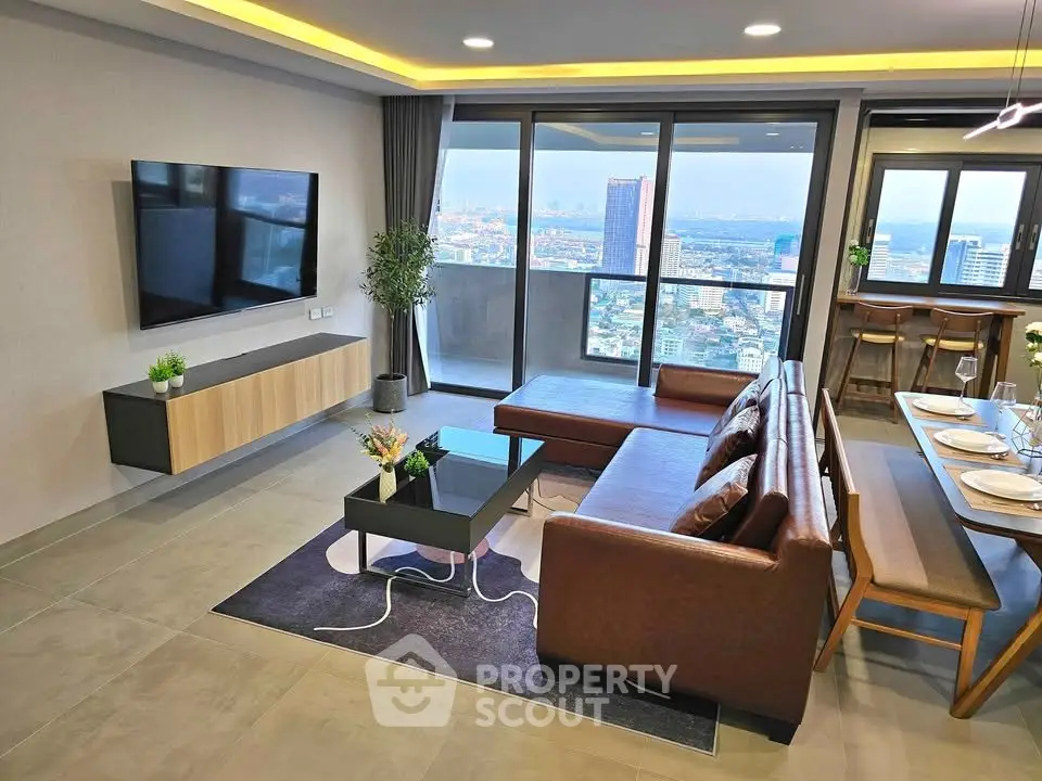 Modern living room with city view, stylish furniture, and open layout for seamless living experience.
