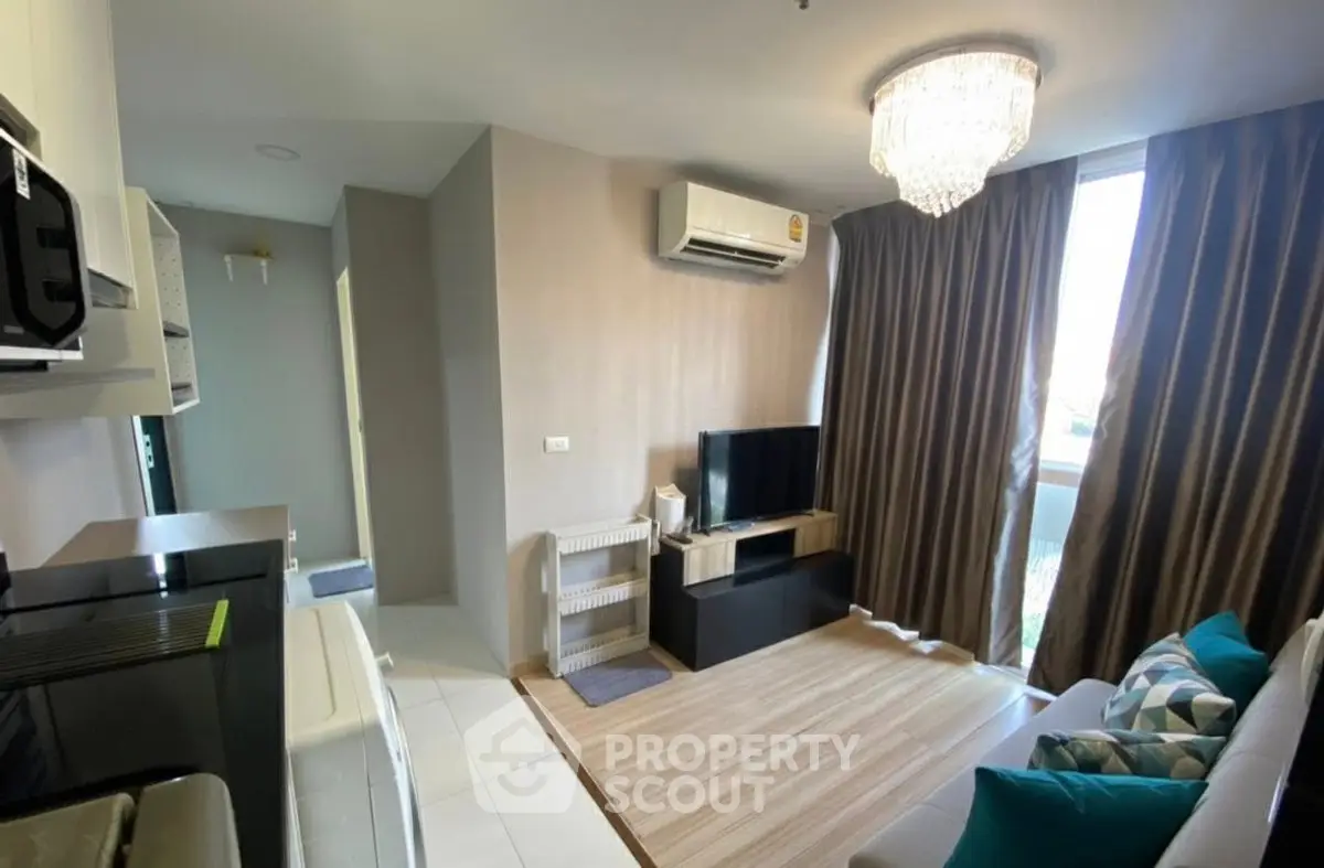 Modern living room with elegant chandelier and cozy decor