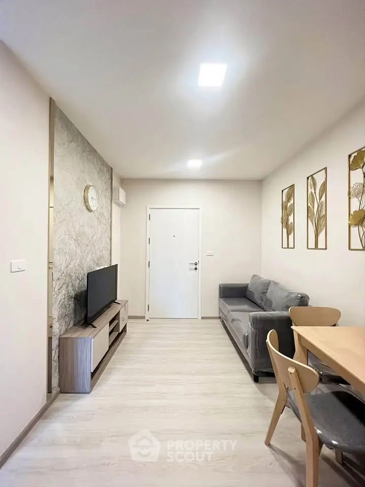 Modern living room with stylish decor and cozy furniture in a contemporary apartment.