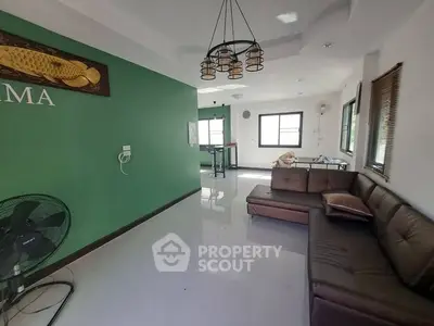 Spacious living room with modern decor and natural light