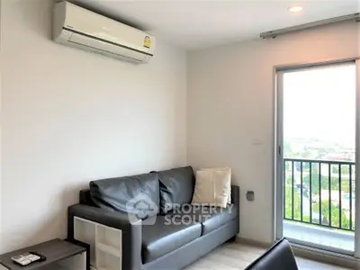 Modern living room with sleek black sofa and air conditioning, featuring a balcony with a scenic view.