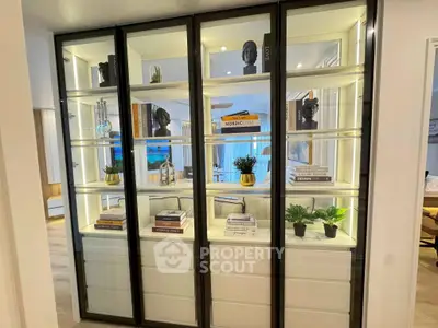 Stylish living room with modern glass display shelves and elegant decor