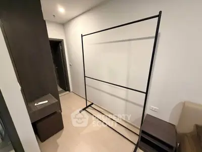 Minimalist bedroom with modern open wardrobe and sleek design