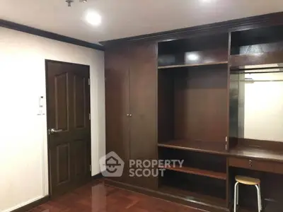 Spacious wooden wardrobe in a modern bedroom with elegant design