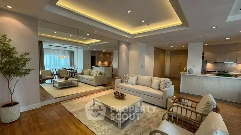 Luxurious living room with elegant decor and open kitchen layout