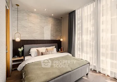 Luxurious bedroom with elegant decor and large window for natural light