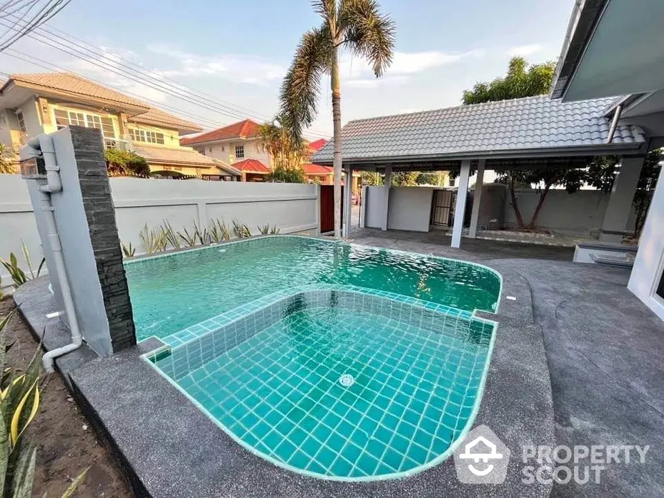 Stunning private pool in a serene residential backyard with modern design and lush surroundings.