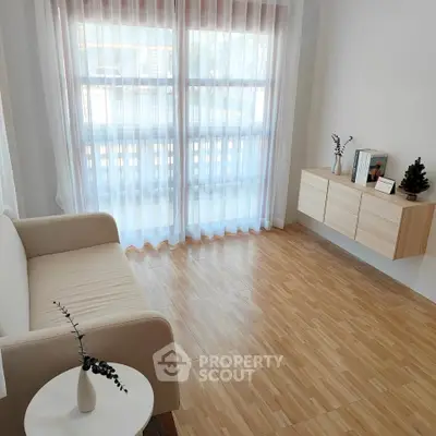 Minimalist living room with natural light and modern decor