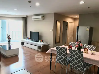 Spacious living room with modern decor and dining area in a stylish apartment