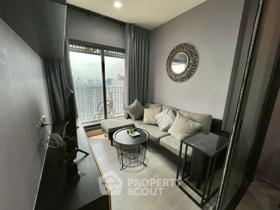 Modern living room with city view and stylish decor in high-rise apartment