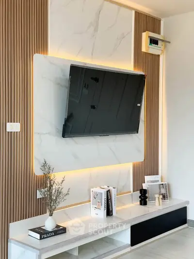 Modern living room with stylish TV wall panel and elegant decor