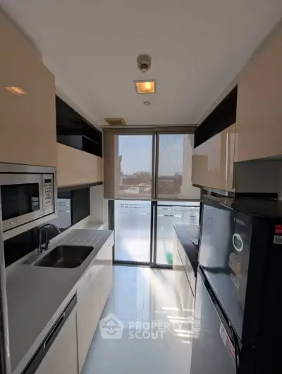 Modern kitchen with sleek design and ample natural light