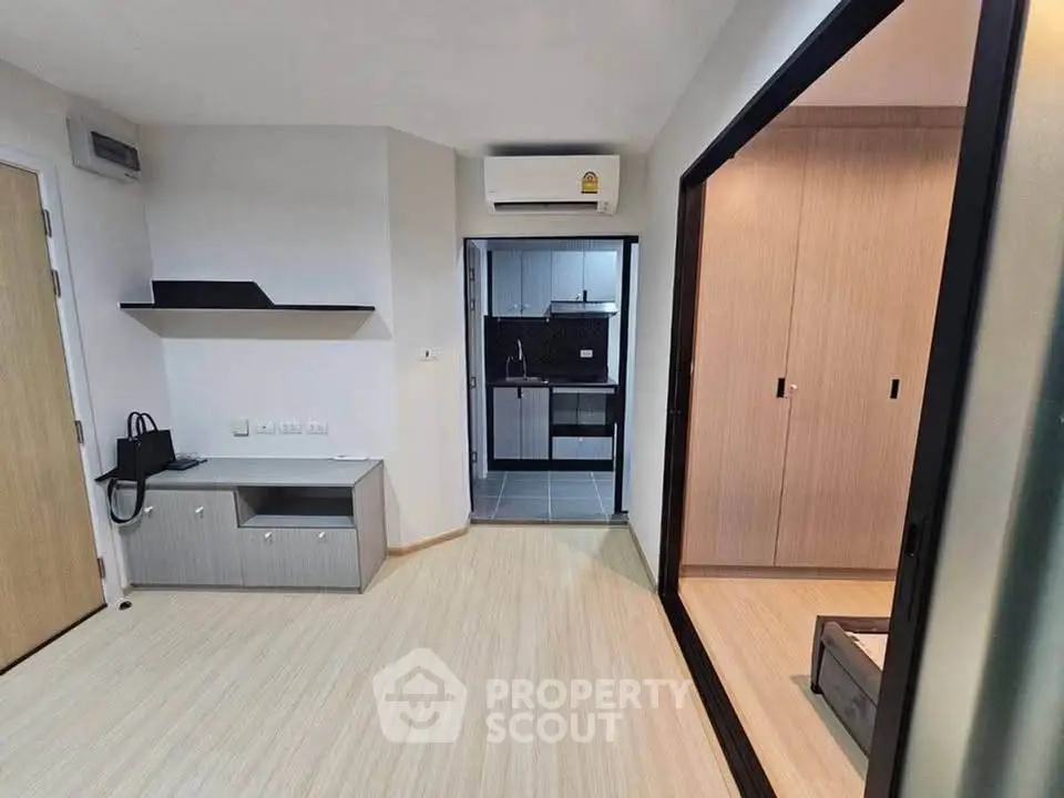 Modern apartment interior with open layout and sleek kitchen design