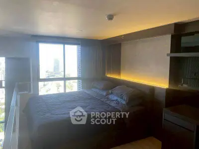 Modern bedroom with large window and city view, featuring cozy bedding and ambient lighting.