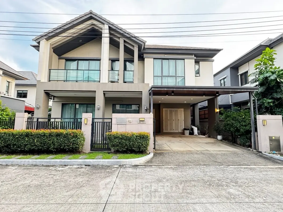 Stunning modern two-story house with spacious driveway and lush greenery