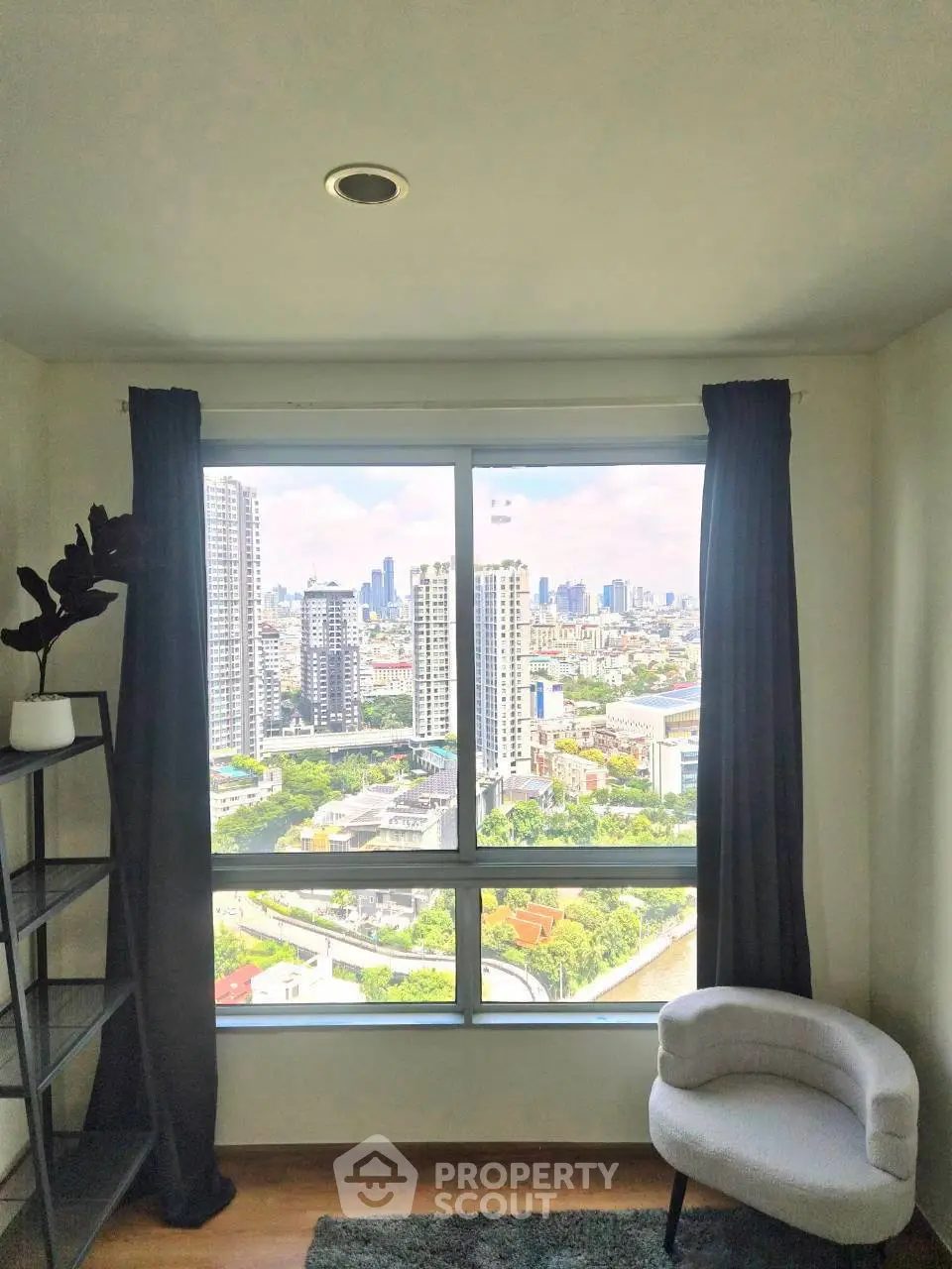 Stunning high-rise apartment with panoramic city views and modern interior design.