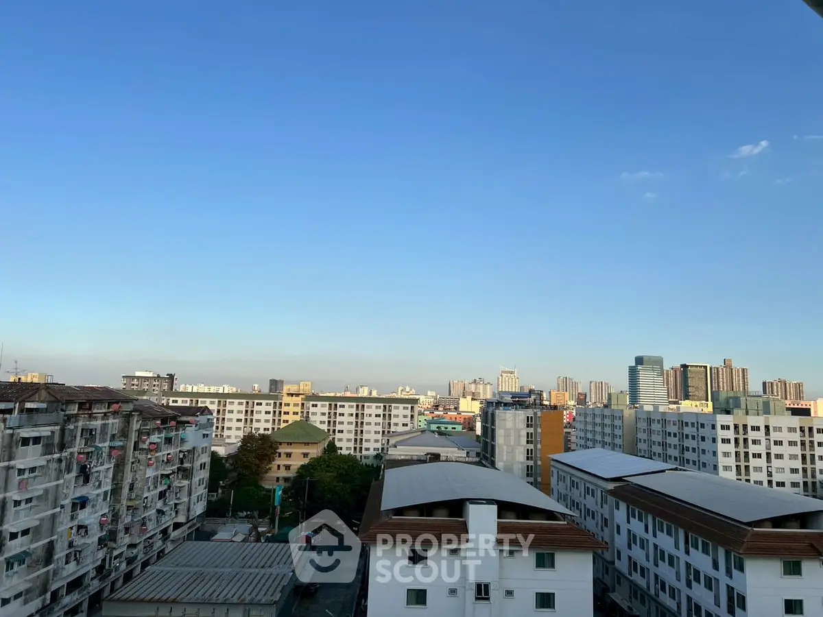 Panoramic cityscape view from a residential building rooftop