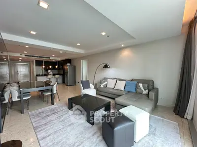 Spacious modern living room with open kitchen and stylish decor
