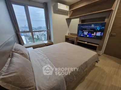 Modern bedroom with city view, featuring a cozy bed, wall-mounted TV, and stylish wooden furnishings.