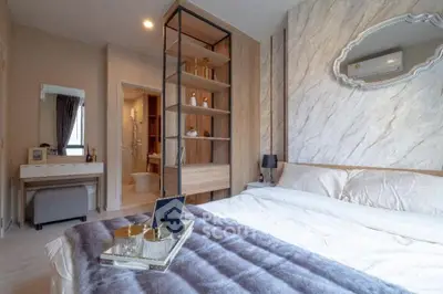 Luxurious bedroom with elegant decor and modern furnishings, featuring a cozy bed and stylish shelving.