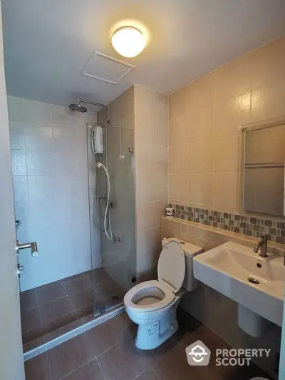 Modern bathroom with glass shower and sleek fixtures