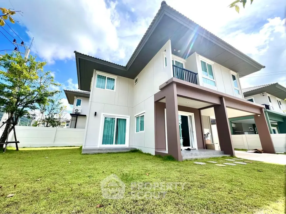 Modern two-story house with spacious lawn and contemporary design